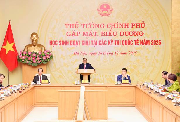 A group of people sitting at a podium Description automatically generated