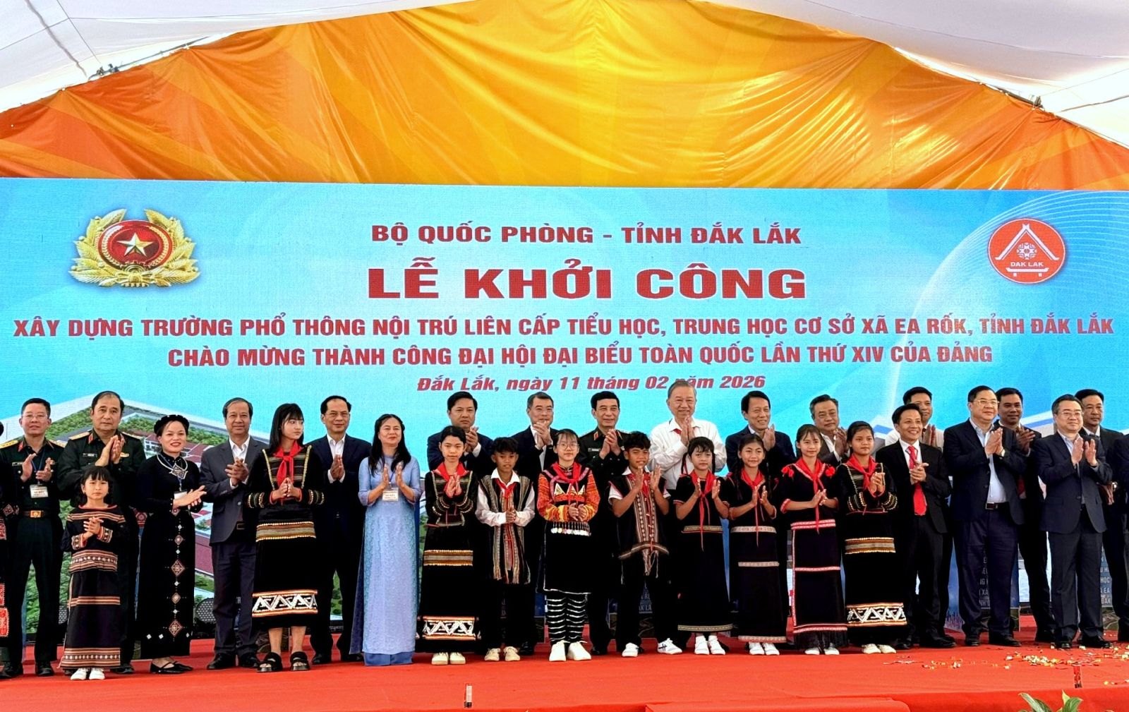 A group of people standing on a stage Description automatically generated